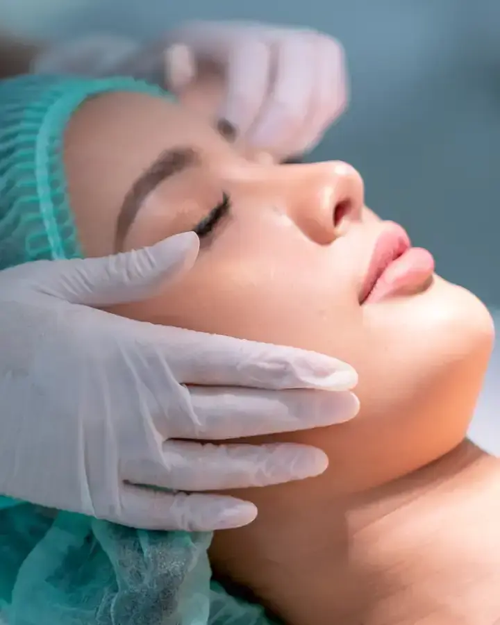 a woman getting a facial injection at the beauty salon