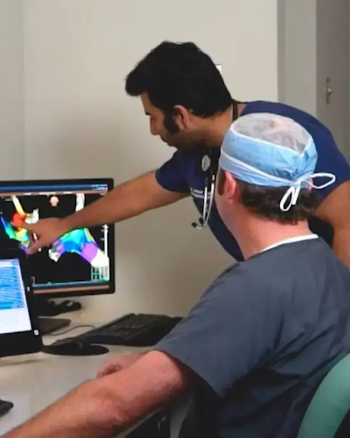 two-men-looking-at-scan-results