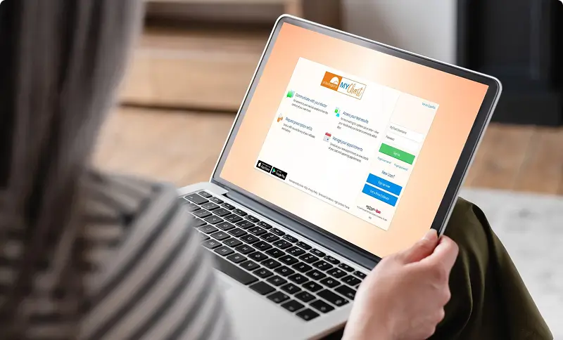 Person logging into MyChart on their laptop