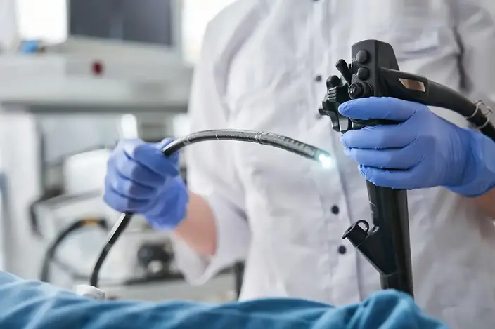 doctor holding endoscopy tube
