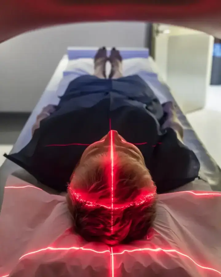 person laying in scanning machine