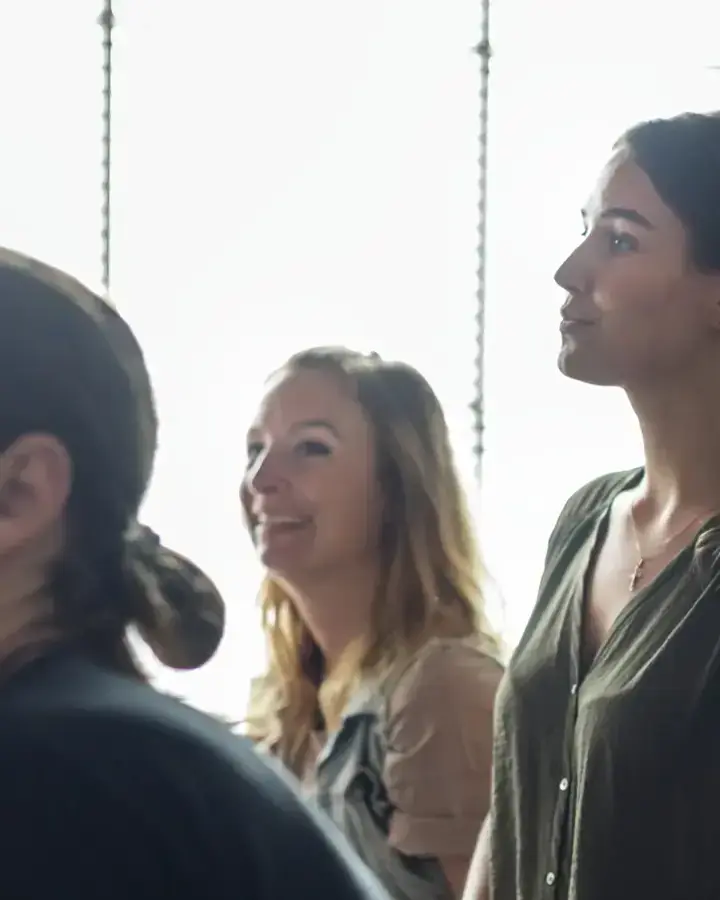 a group of people standing in a line