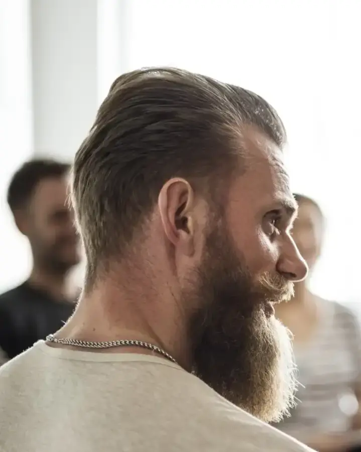 two men in group discussion