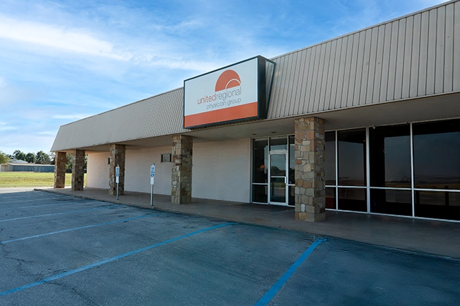 front-of-building-entrance-with-parking-lot